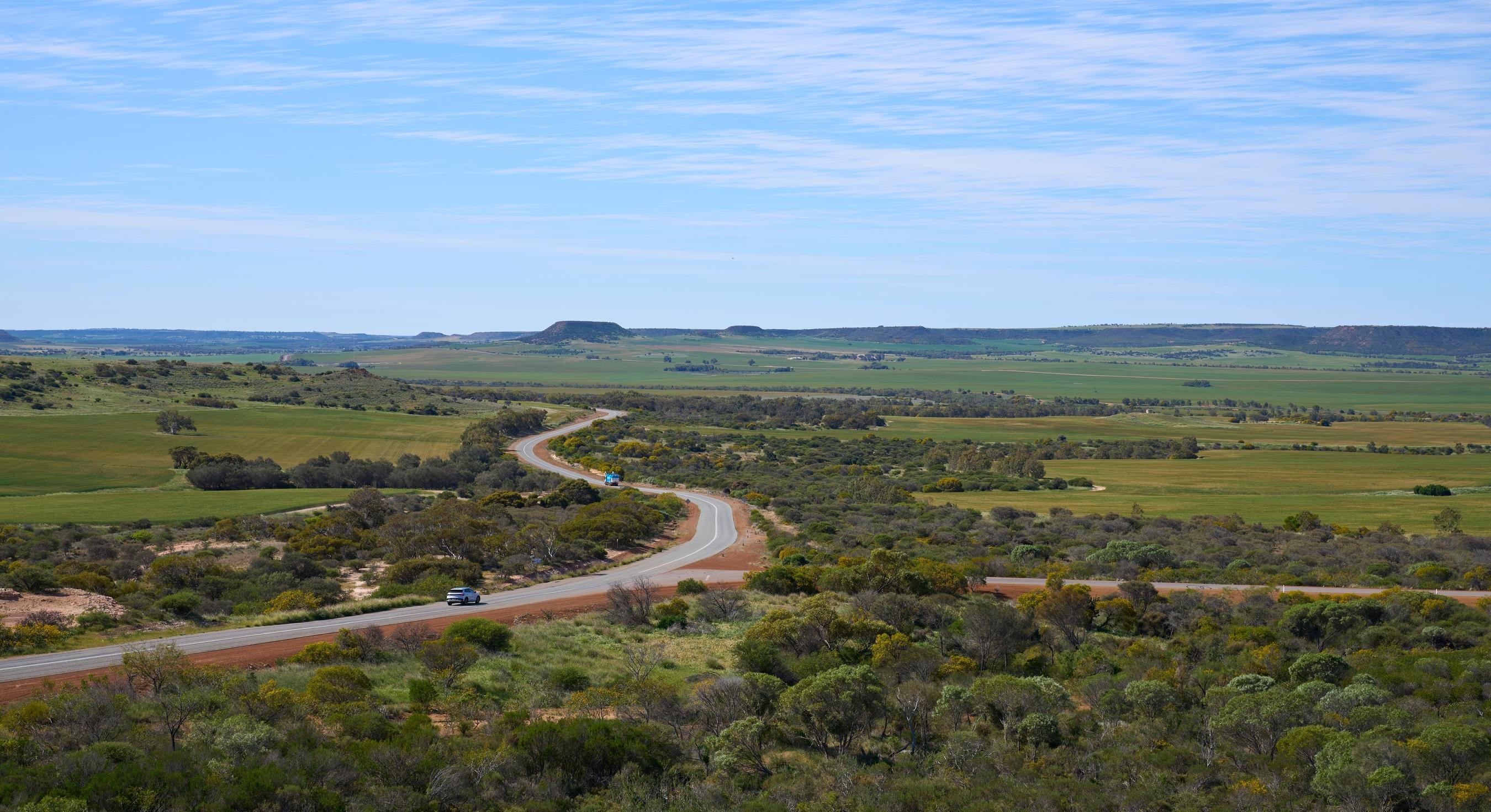 A far view of a car travelling down a road in Geraldton Western Australia